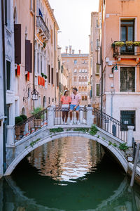 Canal amidst buildings in city