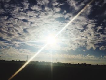 Sun shining over landscape