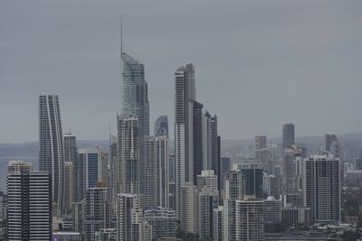 Modern buildings in city against sky