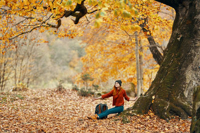 Woman sitting in a forest