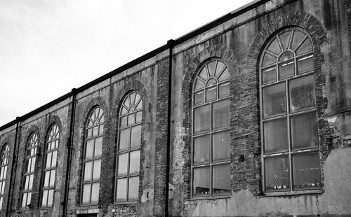 Low angle view of old building against clear sky