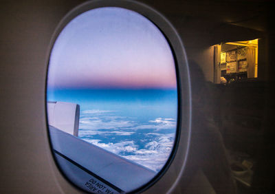 Scenic view of sea seen through airplane window