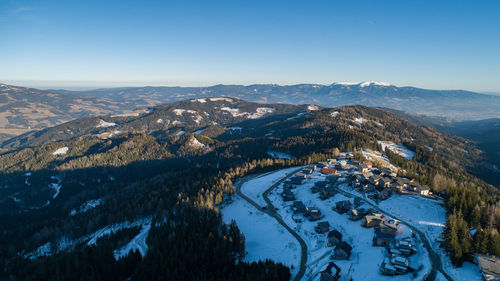 High angle view of snowcapped mountains against sky