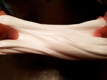 Close-up of hand holding white flower