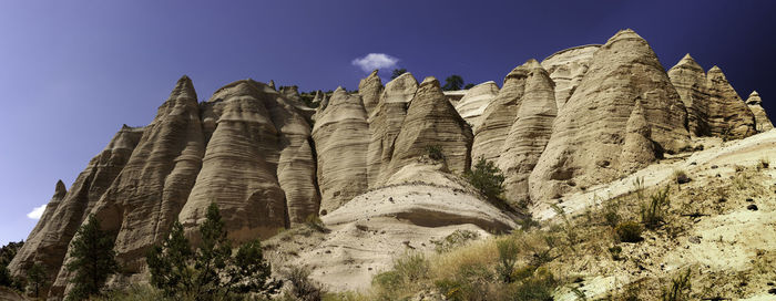 Low angle view of rock formation against sky