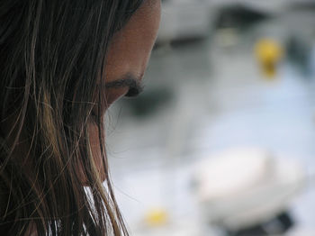 Close-up of woman against blurred background