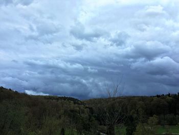 Scenic view of landscape against cloudy sky