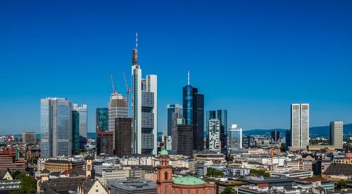 Modern cityscape against clear sky