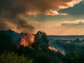 Scenic view of mountains against sky during sunset