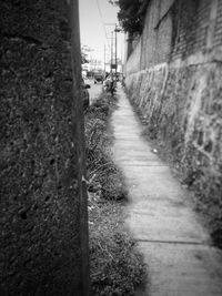 Road amidst city against sky