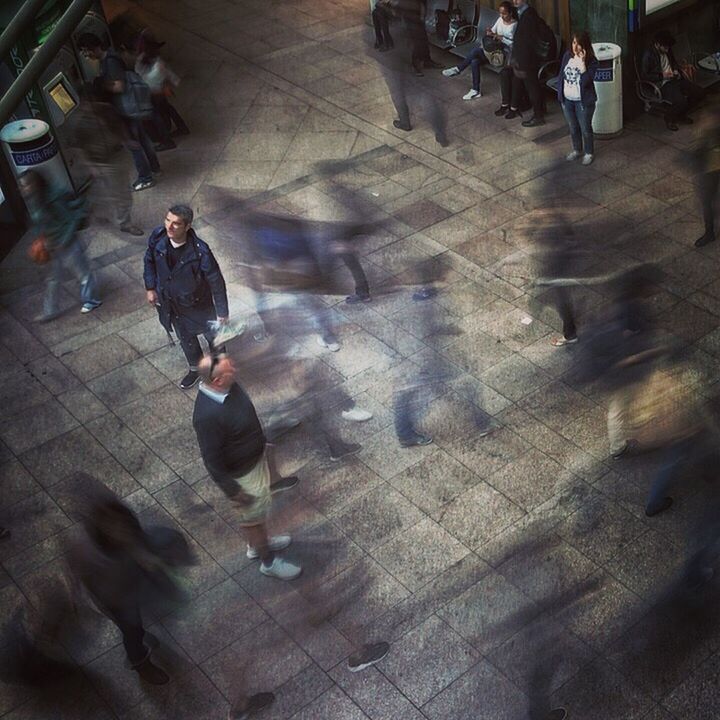 HIGH ANGLE VIEW OF PEOPLE WALKING ON STREET