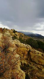 Rock formations on landscape against sky