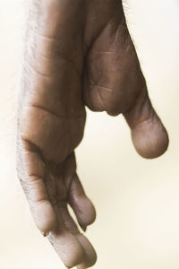 Low section of father with daughter against white background