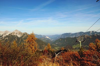 Scenic view of mountains against blue sky