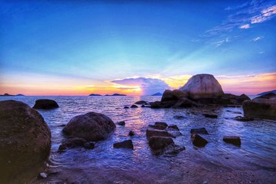 Scenic view of sea against sky at sunset