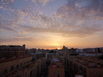 High angle view of buildings against sky during sunset