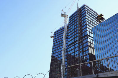 Low angle view of modern building against clear sky