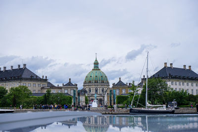 Buildings in city against sky