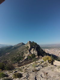 Scenic view of landscape against clear blue sky