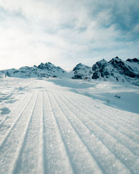 Scenic view of snowcapped pizol against sky