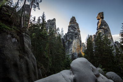 Low angle view of rocks against sky