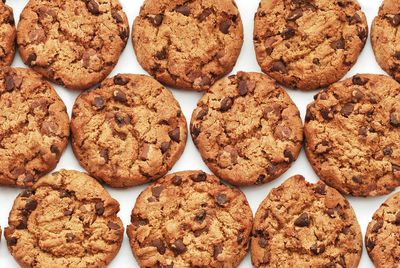 Full frame shot of chocolate chip cookie on white background