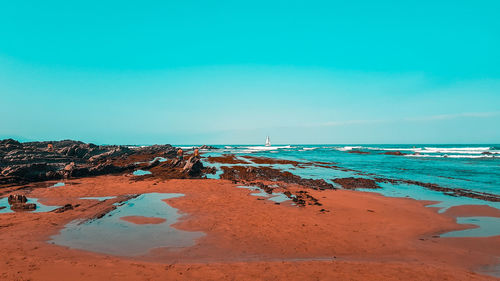 Scenic view of beach against sky