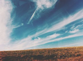 Scenic view of landscape against cloudy sky