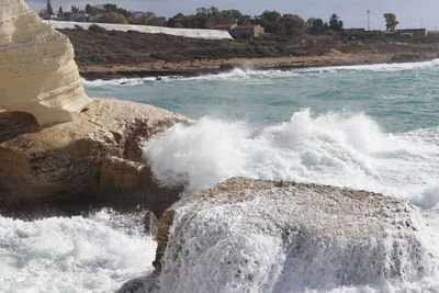 Sea waves splashing on rocks