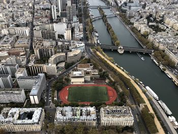 High angle view of bridge over river amidst buildings in city