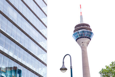 Low angle view of street light against buildings