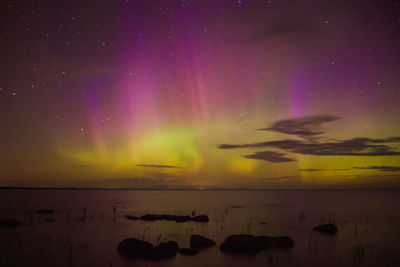 Scenic view of sea against sky at night