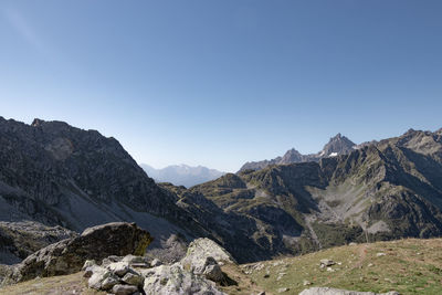 Scenic view of mountains against clear blue sky