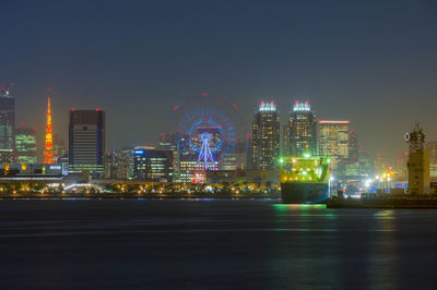 Illuminated buildings in city at night