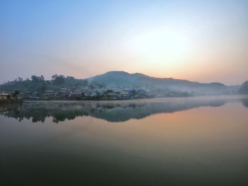 Scenic view of lake against sky during sunset