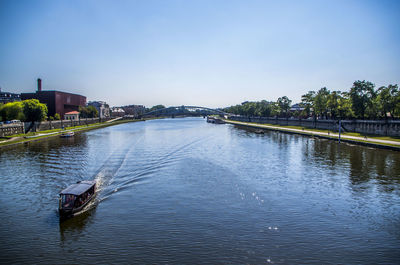 Calm river with buildings in background