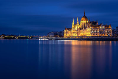 Illuminated buildings at waterfront