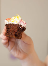 Close-up of hand holding ice cream