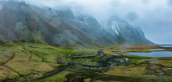 Aerial view of a viking village on a stormy rainy day in iceland.