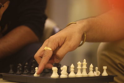 People playing chess at home