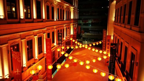 Buildings in city at night