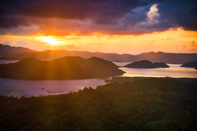 Scenic view of silhouette mountains against sky during sunset