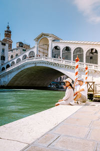 Bridge over canal against sky