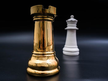 Close-up of chess pieces on table