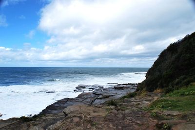 Scenic view of beach and sea against sky