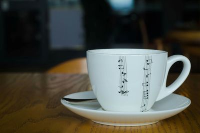 Close-up of coffee cup on table