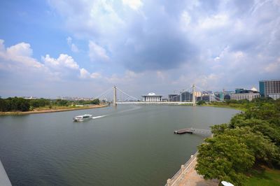 Bridge over river with city in background