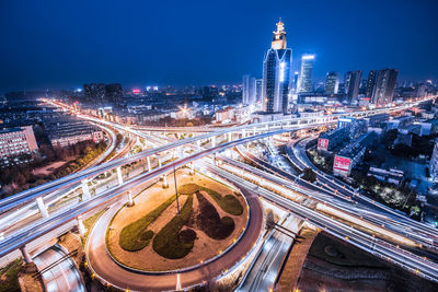 High angle view of illuminated city against sky