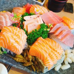 High angle view of salmon sashimi in plate on table