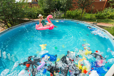 High angle view of people swimming in pool